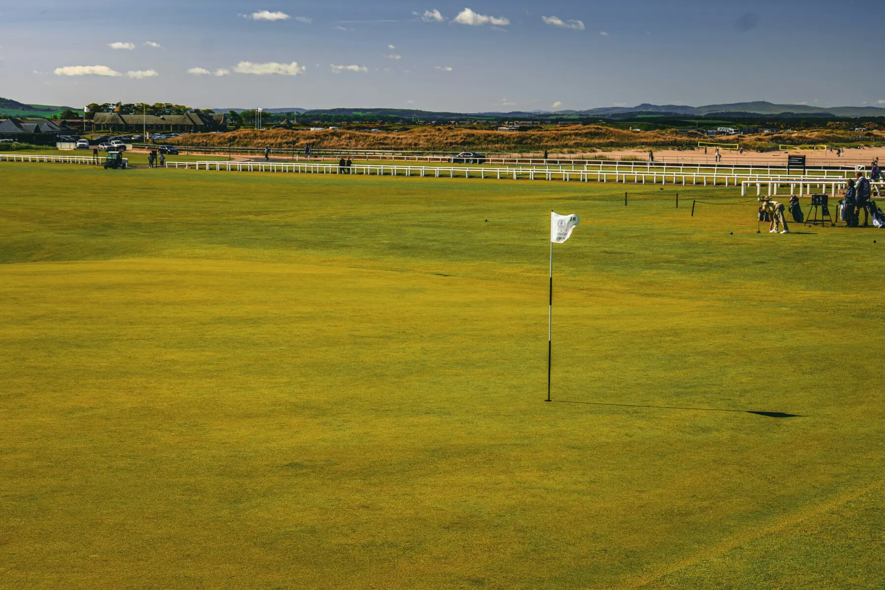 Golf green with flag pin on a Scottish links course in Fife